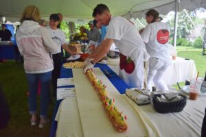 Chef making a huge sandwich in the "Best Sandwich in Sandwich" Competition during SandwichFest.