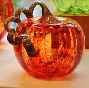 beautiful hand-blown glass pumpkin with twirly stem made at the Sandwich Glass Museum